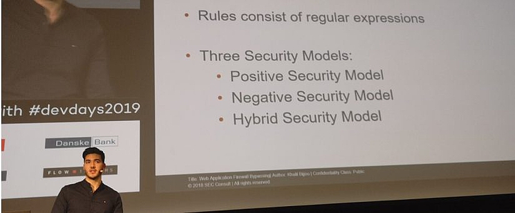 Man giving presentation at Days Europe Conference - SEC Consult